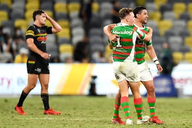 Nathan Cleary of the Panthers looks dejected as Blake Taaffe and Cody Walker of the Rabbitohs celebrate victory during the NRL Qualifying Final match...