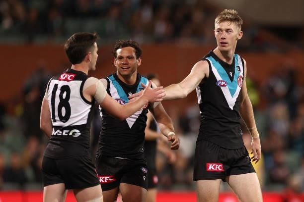 Todd Marshall of the Power is congratulated by team mates after kicking a goal during the AFL Second Preliminary Final match between Port Adelaide...