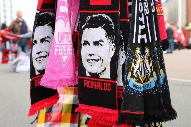 Scarf with the face of Cristiano Ronaldo of Manchester United on is seen being sold outside the stadium prior to the Premier League match between...