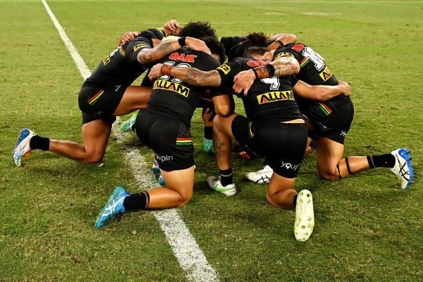 Panthers players pray after the NRL Qualifying Final match between Penrith Panthers and South Sydney Rabbitohs at QCB Stadium, on September 11 in...