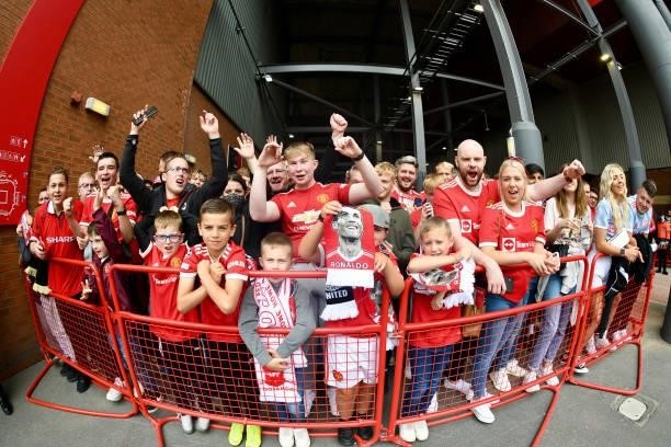 Manchester United fans arrive at Old Trafford ahead of the Premier League match between Manchester United and Newcastle United at Old Trafford on...