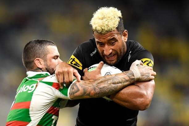 Adam Reynolds of the Rabbitohs tackles Viliame Kikau of the Panthers during the NRL Qualifying Final match between Penrith Panthers and South Sydney...