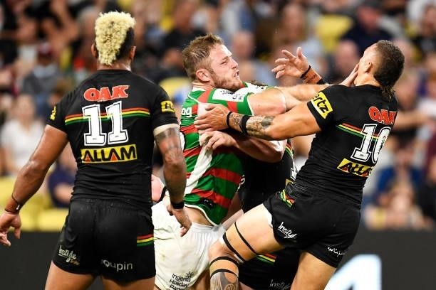 Thomas Burgess of the Rabbitohs is tackled by James Fisher-Harris of the Panthers during the NRL Qualifying Final match between Penrith Panthers and...