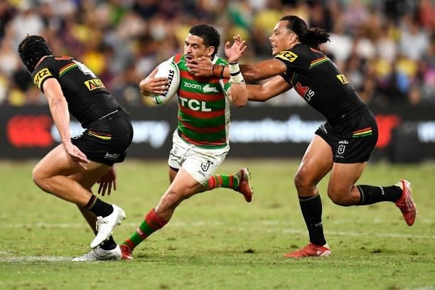 Cody Walker of the Rabbitohs tries to evade the tackle of Matt Burton and Jerome Luai of the Panthers during the NRL Qualifying Final match between...