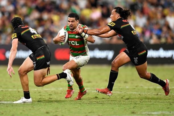Cody Walker of the Rabbitohs tries to evade the tackle of Matt Burton and Jerome Luai of the Panthers during the NRL Qualifying Final match between...