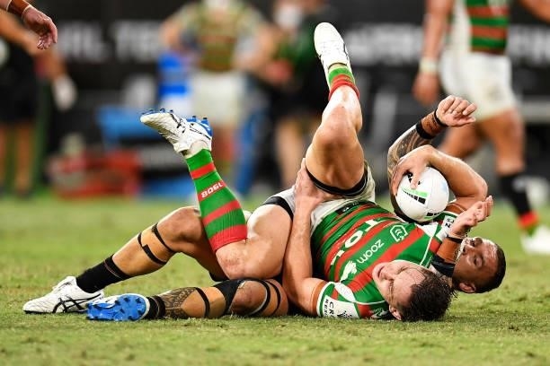 Cameron Murray of the Rabbitohs holds his leg as he is tackled during the NRL Qualifying Final match between Penrith Panthers and South Sydney...