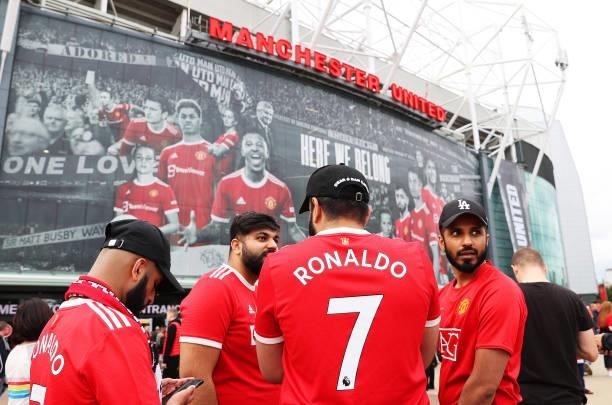 Fans of Manchester United wearing 'Ronaldo - 7' shirts are seen outside the stadium prior to the Premier League match between Manchester United and...