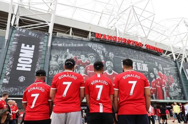 Fans of Manchester United wearing 'Ronaldo - 7' shirts are seen outside the stadium prior to the Premier League match between Manchester United and...