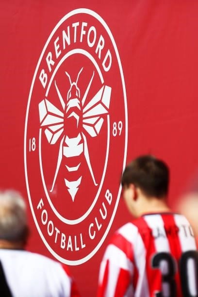 Detailed view of the Brentford badge is seen as fans make their way towards the stadium prior to the Premier League match between Brentford and...