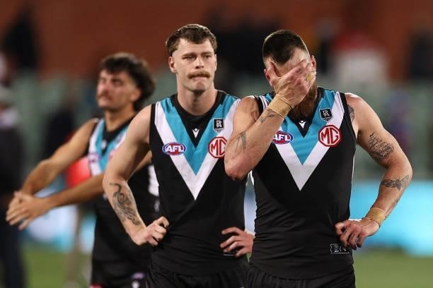 Peter Ladhams and Charlie Dixon of the Power look dejected after losing the AFL Second Preliminary Final match between Port Adelaide Power and...