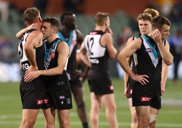 Ollie Wines and Orazio Fantasia of the Power look dejected after losing the AFL Second Preliminary Final match between Port Adelaide Power and...