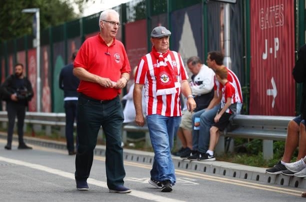 Fans of Brentford make their way towards the stadium prior to the Premier League match between Brentford and Brighton & Hove Albion at Brentford...