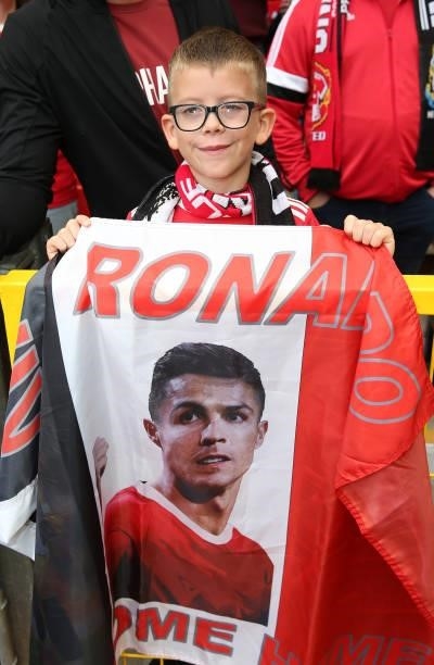 Manchester United fans holds a Cristiano Ronaldo flag ahead of the Premier League match between Manchester United and Newcastle United at Old...