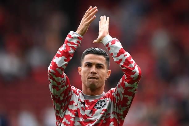Cristiano Ronaldo of Manchester United applauds the fans as he warms up prior to the Premier League match between Manchester United and Newcastle...