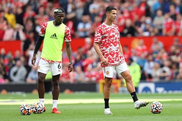 Paul Pogba and Cristiano Ronaldo of Manchester United warm up prior to the Premier League match between Manchester United and Newcastle United at Old...