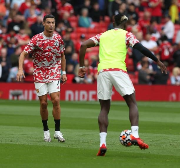Cristiano Ronaldo and Paul Pogba of Manchester United warms up ahead of the Premier League match between Manchester United and Newcastle United at...