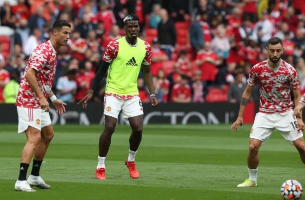 Cristiano Ronaldo , Paul Pogba, Bruno Fernandes of Manchester United warms up ahead of the Premier League match between Manchester United and...