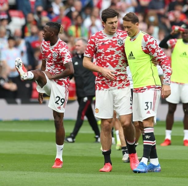 Harry Maguire and Nemanja Matic of Manchester United warms up ahead of the Premier League match between Manchester United and Newcastle United at Old...
