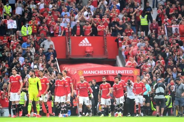 Cristiano Ronaldo of Manchester United makes his way on to the pitch with his team mates prior to the Premier League match between Manchester United...