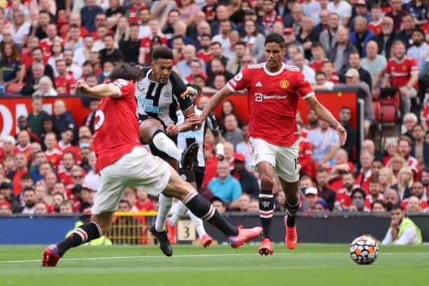 Joelinton of Newcastle United shoots during the Premier League match between Manchester United and Newcastle United at Old Trafford on September 11,...