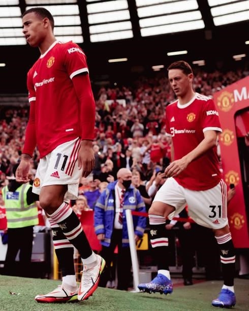 Mason Greenwood and Nemanja Matic of Manchester United walks out ahead of the Premier League match between Manchester United and Newcastle United at...
