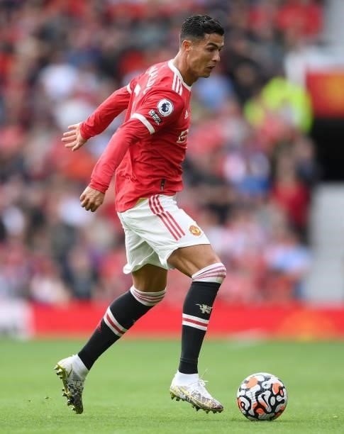 Cristiano Ronaldo of Manchester United runs with the ball during the Premier League match between Manchester United and Newcastle United at Old...