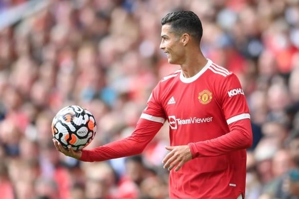 Cristiano Ronaldo of Manchester United reacts as he holds the match ball during the Premier League match between Manchester United and Newcastle...
