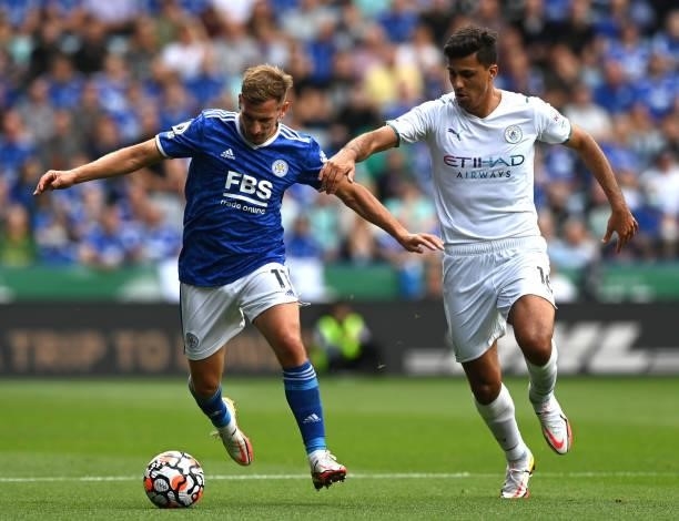Marc Albrighton of Leicester City battles for possession with Rodrigo of Manchester City during the Premier League match between Leicester City and...