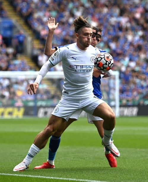 Jack Grealish of Manchester City battles for possession with Timothy Castagne of Leicester City during the Premier League match between Leicester...