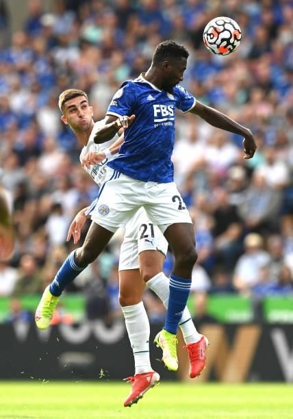 Wilfred Ndidi of Leicester City competes for a header with Ferran Torres of Manchester City during the Premier League match between Leicester City...