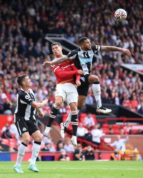 Cristiano Ronaldo of Manchester United competes for a header with Jamaal Lascelles of Newcastle United during the Premier League match between...