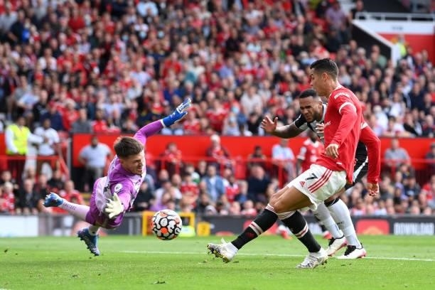 Cristiano Ronaldo of Manchester United scores their side's first goal during the Premier League match between Manchester United and Newcastle United...