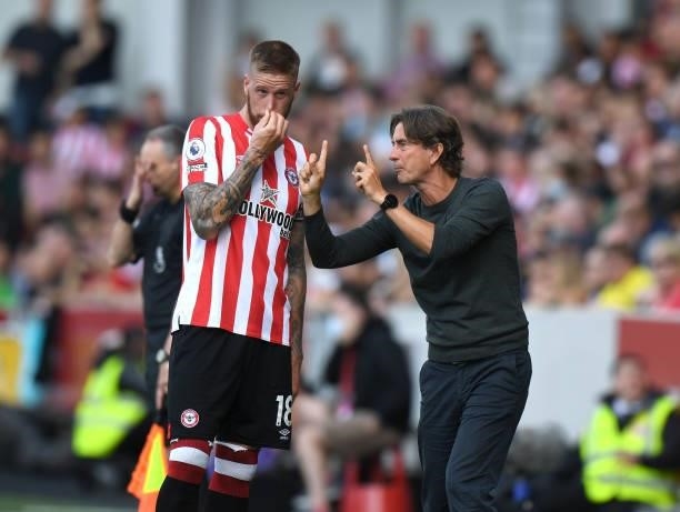 Brentford Head Coach Thomas Frank gives instructions to Pontus Jansson of Brentford during the Premier League match between Brentford and Brighton &...
