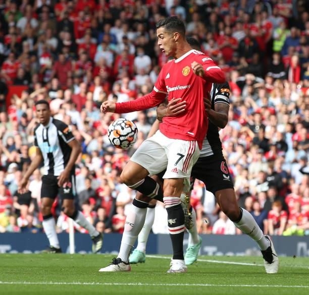 Cristiano Ronaldo of Manchester United in action with Jamaal Lascelles of Newcastle United during the Premier League match between Manchester United...