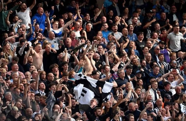 Fans of Newcastle United show their support during the Premier League match between Manchester United and Newcastle United at Old Trafford on...
