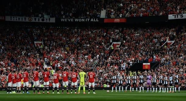 Players from both teams line up for a minutes applause during the Premier League match between Manchester United and Newcastle United at Old Trafford...