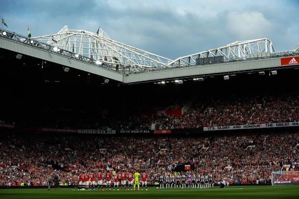 Players from both teams line up for a minutes applause during the Premier League match between Manchester United and Newcastle United at Old Trafford...