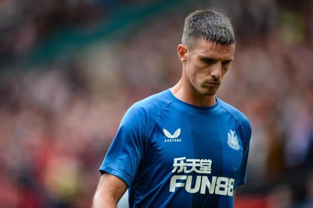 Ciaran Clark of Newcastle United FC warms up during the Premier League match between Manchester United and Newcastle United at Old Trafford on...