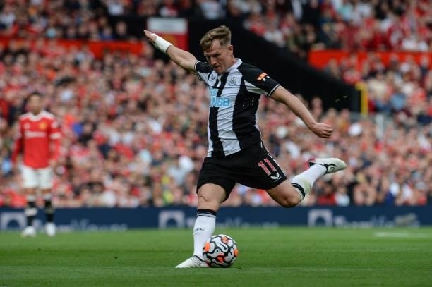 Matt Ritchie of Newcastle United FC strikes the ball during the Premier League match between Manchester United and Newcastle United at Old Trafford...