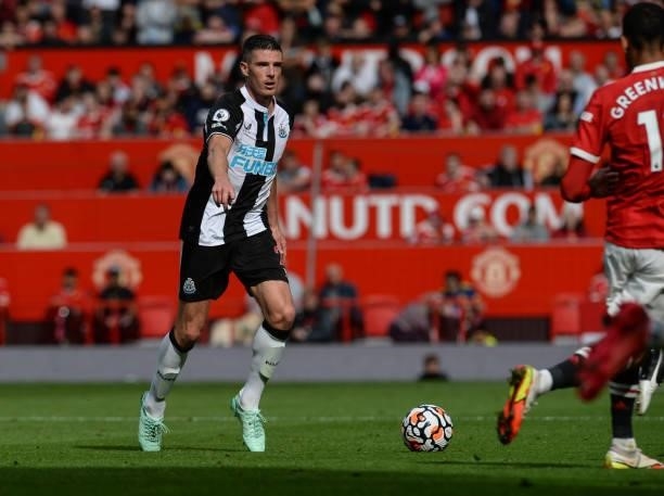 Ciaran Clark of Newcastle United FC passes the ball during the Premier League match between Manchester United and Newcastle United at Old Trafford on...