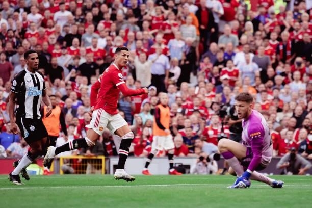 Cristiano Ronaldo of Manchester United scores their second goal during the Premier League match between Manchester United and Newcastle United at Old...