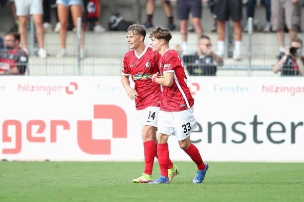 Noah Weisshaupt of SC Freiburg celebrates with Yannik Keitel after scoring their side's first goal during the Bundesliga match between Sport-Club...
