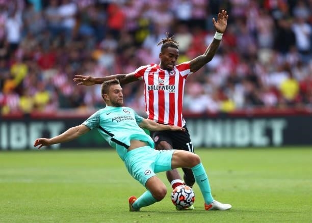 Joel Veltman of Brighton & Hove Albion is challenged by Ivan Toney of Brentford during the Premier League match between Brentford and Brighton & Hove...