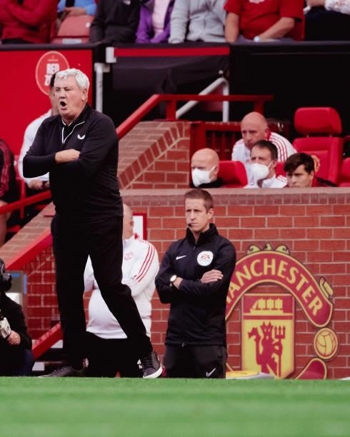 Manager Steve Bruce of Newcastle United watches from the touchline during the Premier League match between Manchester United and Newcastle United at...