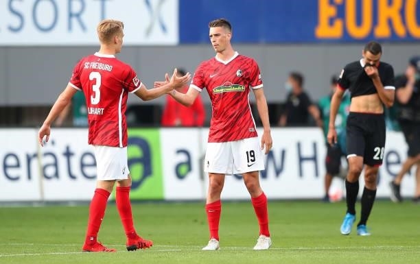 Janik Haberer and Philipp Lienhart of SC Freiburg celebrate their side's victory after the Bundesliga match between Sport-Club Freiburg and 1. FC...