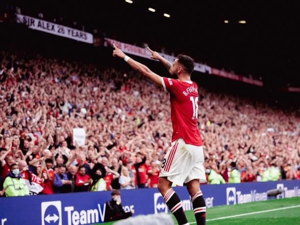Bruno Fernandes of Manchester United celebrates scoring their third goal during the Premier League match between Manchester United and Newcastle...