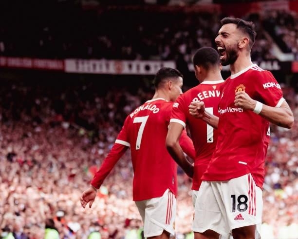 Bruno Fernandes of Manchester United celebrates scoring their third goal during the Premier League match between Manchester United and Newcastle...