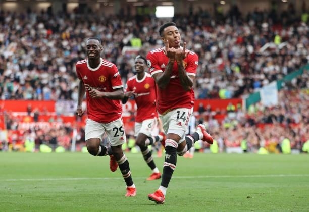 Jesse Lingard of Manchester United celebrates after scoring their side's fourth goal during the Premier League match between Manchester United and...