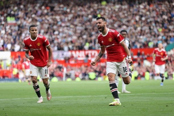 Bruno Fernandes of Manchester United celebrates after scoring their side's third goal during the Premier League match between Manchester United and...