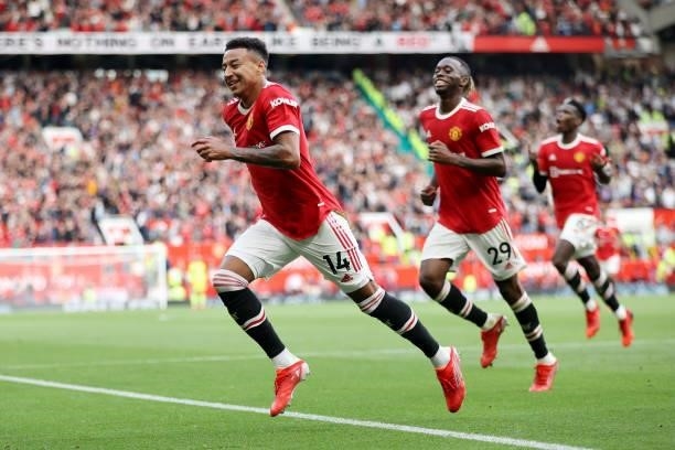 Jesse Lingard of Manchester United celebrates after scoring their side's fourth goal during the Premier League match between Manchester United and...
